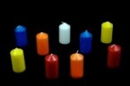 18091080-different-colored-candles-on-a-black-background